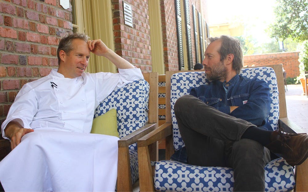 Executive Chef at the Carolina Inn Brandon Sharp (left), discusses what keeps bringing him and his brother, Graham (right), back to Chapel Hill. Graham performed Friday evening at Memorial Hall as part of the Steep Canyon Rangers.&nbsp;