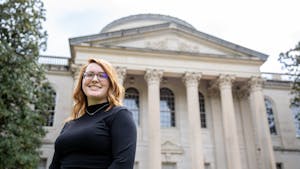 UNC graduate student Sarah Bulger poses for a portrait in front of Wilson Library on April 18, 2021. Bulger is a participant in the UNC Story Archive project based in the Wilson Special Collections Library.