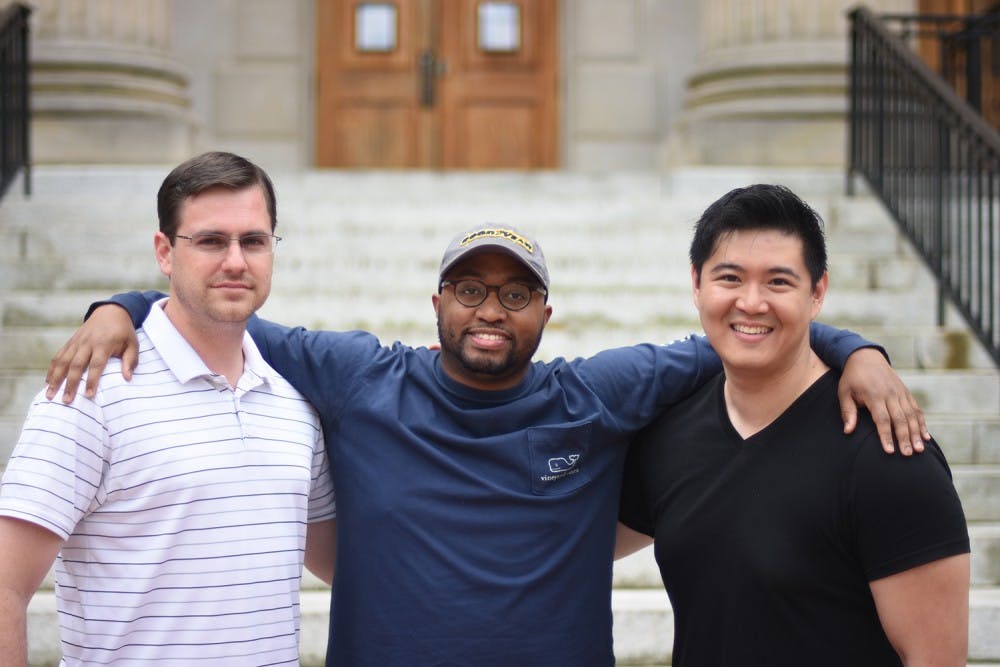 Joseph Hiatt (left), Marco Sommerville II (middle), and Wen Lin are all second year MBA students that started the initiative for a class that partners restaurants with the Durham rescue mission. 