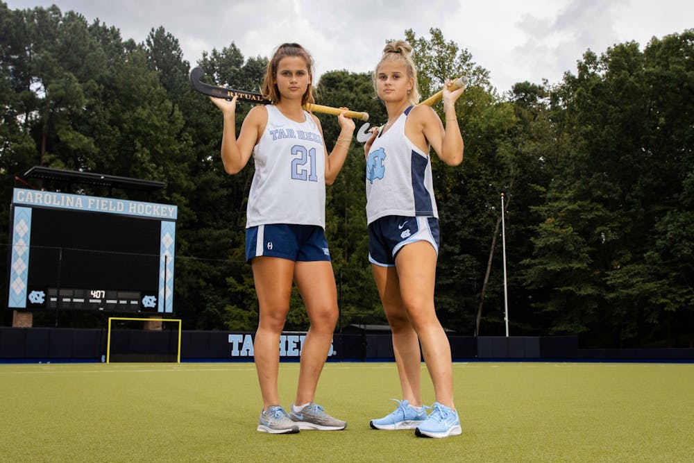 Sisters Eva and Jasmina Smolenaar are sharing one semester competing for the Tar Heels on the field hockey team. They are pictured in Karen Shelton Stadium on Sept. 8.