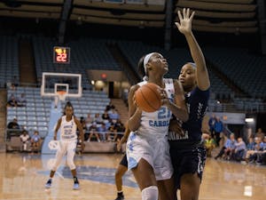 UNC first-year forward Malu Tshitenge (21) aims for the basket with CSU senior center Jasmine Blackmon (44) on defense. The Tar Heels beat the Buccaneers 85-54 on Friday, Nov, 15, 2019 at Carmichael Arena.