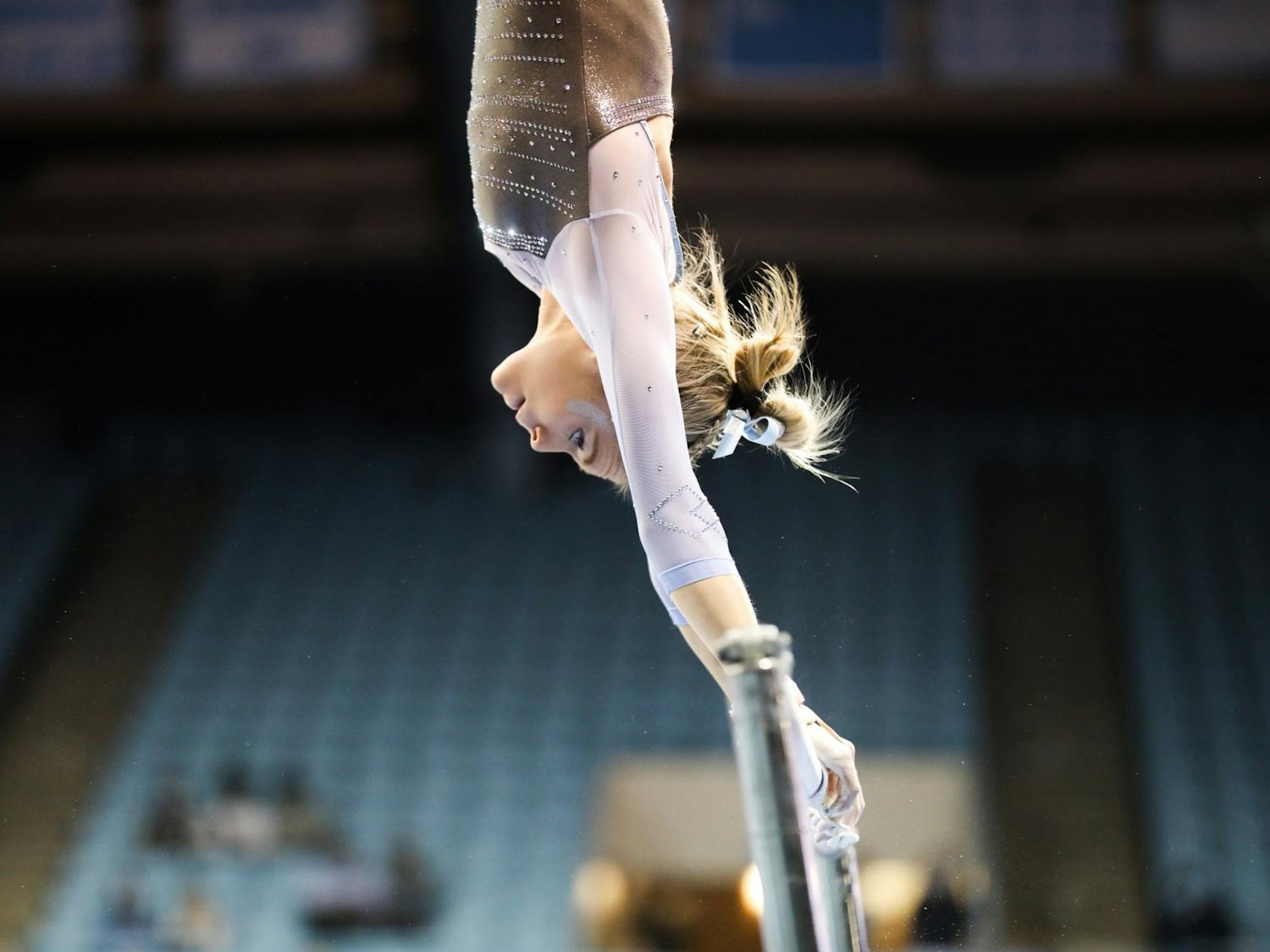 Junior Elizabeth Culton First-year competes on uneven bars during UNC gymnastics' home meet at Carmichael Arena on Friday, Jan. 28, 2022. Culton scored a 9.850, tying her for first on bars.