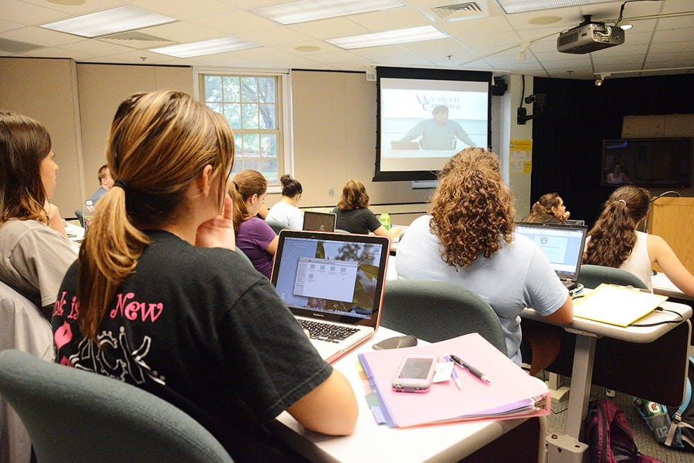 	Students listen to Tom Belt, an instructor of Cherokee who teaches five different levels of the class at UNC via webcam.