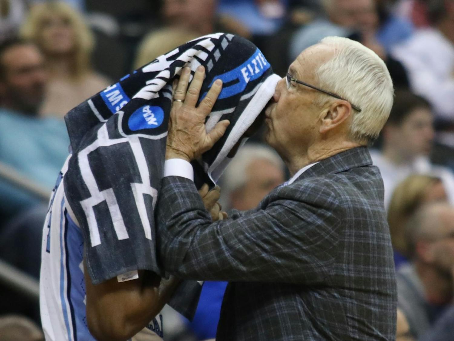 Head Coach Roy Williams kisses senior guard Kenny Williams (24) on the forehead at the end of UNC's 97-80 loss against Auburn in the Sweet 16 of the NCAA Tournament on Friday, March 29, 2019 at the Sprint Center in Kansas City, M.O.