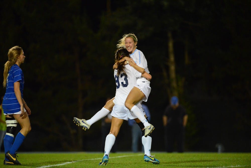 	Cameron Castleberry (left) celebrates with Brooke Elby after scoring her first career goal in the 35th
minute against Duke Thursday at Fetzer Field. UNC took the match 3-0 and will play again Sunday.