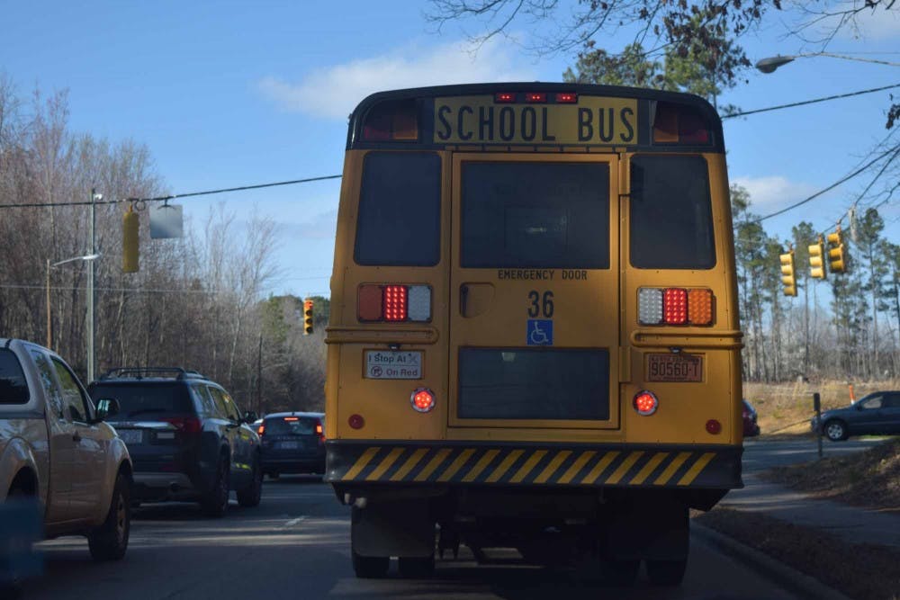 <p>A school bus drives down MLK Jr. Blvd. on Monday, March 4, 2019.&nbsp;</p>