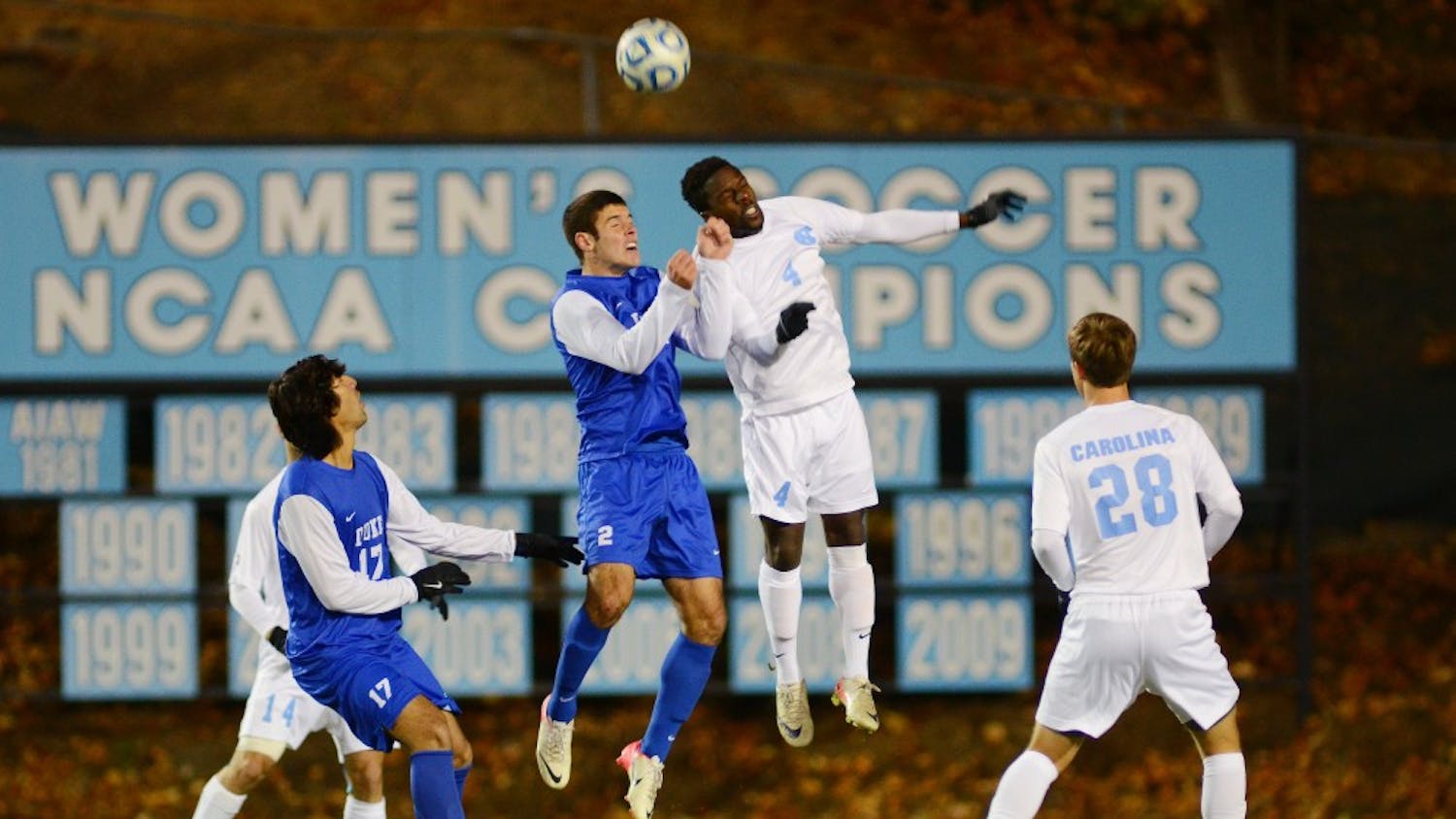 	North Carolina defender Boyd Okwuonu leaps to fend off Duke’s Will Donovan as UNC’s Alex Olofson waits to recieve the ball in the Tar Heels’ 1-0 victory.
