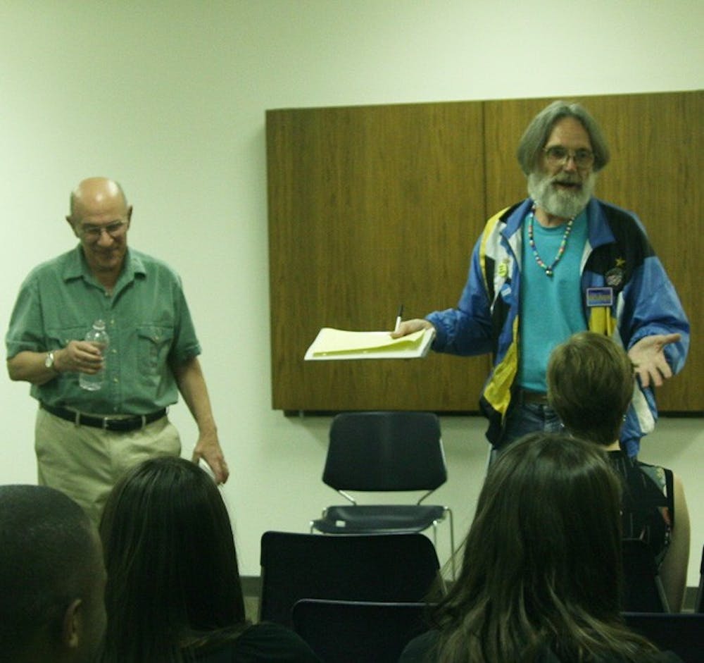 Korky Day, right, who has been advocating for drug legalization for 44 years, spoke during a brief lecture by professor Benavie.