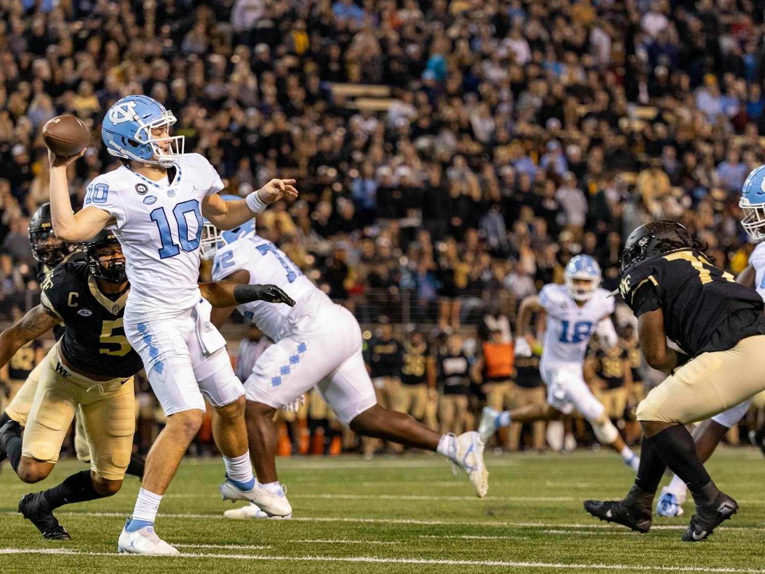 UNC first-year quarterback Drake Maye (10), throws a pass at the UNC vs. Wake Forest football game in Truist Stadium on Nov. 12, 2022. UNC won 36-34.