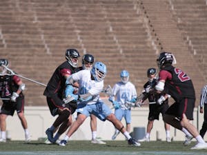 Senior Chris Cloutier (45) rears back for a shot against Lafayette on Feb. 3 in Kenan Stadium.