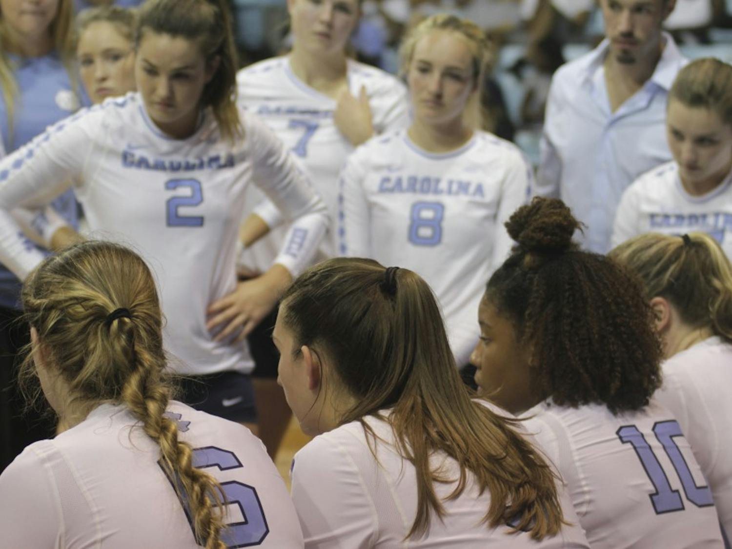 UNC Volleyball team gathers during the fourth set of Fridays game against LMU. 
