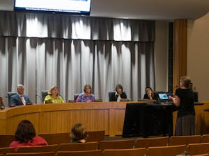 Chapel Hill citizen Kim Piracci delivers passionate call for climate action on behalf of the town council, regardless of financial concerns, at the Town Council Meeting on Sept. 25, 2019.&nbsp;