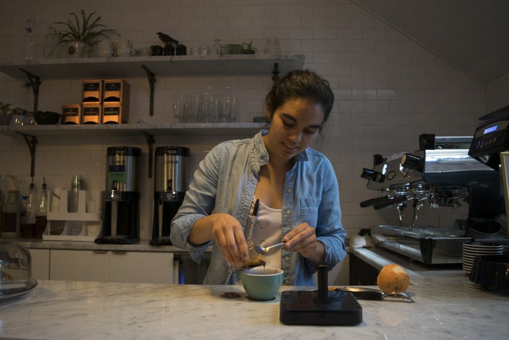 <p>Perennial Coffee and Pastries barista Anna Kasibhatla creates a new brew: a grapefruit infused spiced maple latte in 2017.</p>