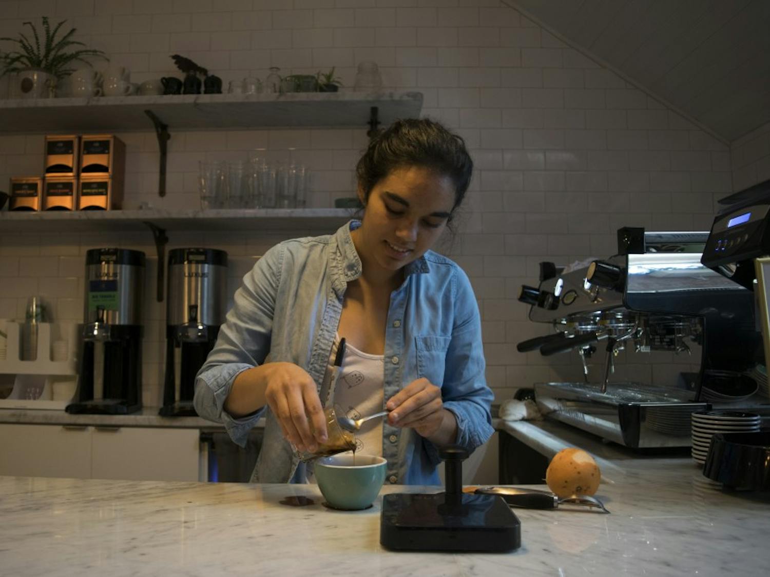 Perennial Coffee and Pastries barista Anna Kasibhatla creates a new brew: a grapefruit infused spiced maple latte in 2017.