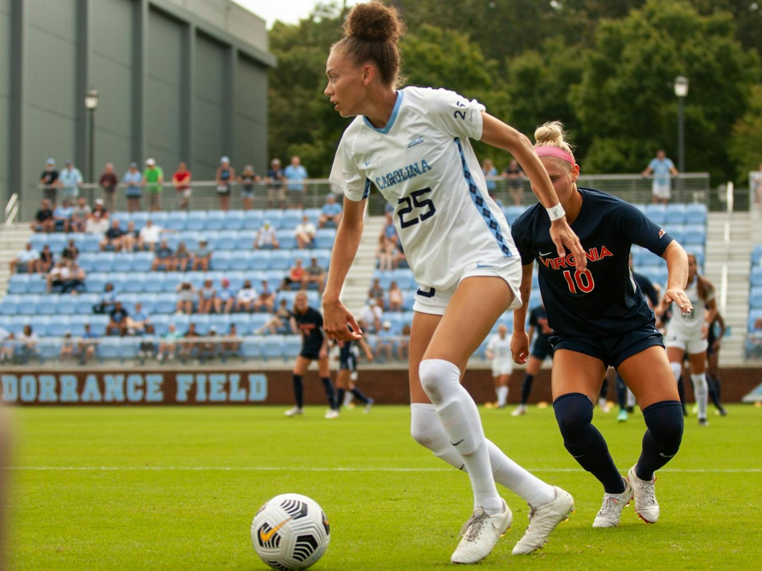Junior defender Maycee Bell (25) dribbles the ball at the game against Virginia on Oct. 3 at Dorrance Field. UNC tied 0-0.