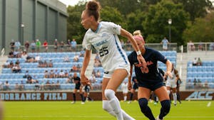 Junior defender Maycee Bell (25) dribbles the ball at the game against Virginia on Oct. 3 at Dorrance Field. UNC tied 0-0.
