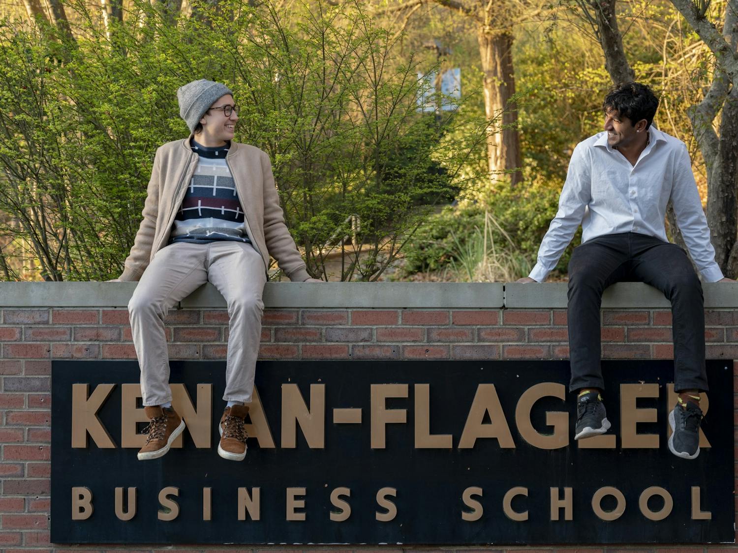 UNC Seniors Ilyas Colie and Manas Takalpati, co-founders of  TriVent sit outside the Kenan-Flagler Business School on Thursday, March 30, 2023.  outside of Kenan-Flagler Business School on Thursday, March 30, 2023.