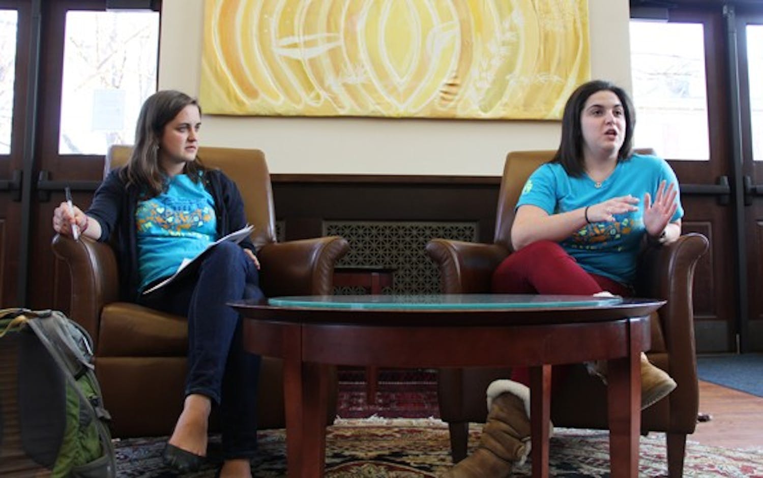 Natalie Borrego and Cora Went discuss their 2013-2014 Campus Y co-president platforms to members of the Campus Y.
