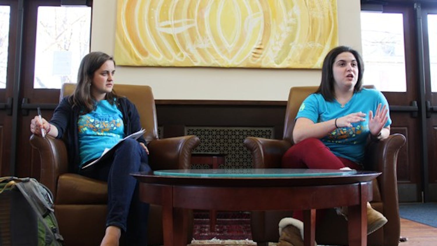Natalie Borrego and Cora Went discuss their 2013-2014 Campus Y co-president platforms to members of the Campus Y.