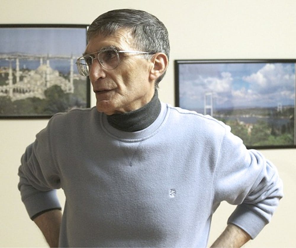 Aziz Sancar stands in the home he owns and runs for UNC students and scholars from Turkey to adjust to campus life.