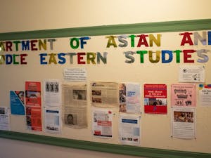 Posters decorate the UNC Department of Asian and Middle Eastern studies bulletin board on Monday, March 27, 2023.