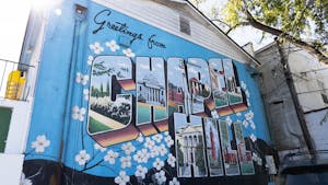 The "Greetings from Chapel Hill" postcard mural located behind He's Not Here, pictured on Tuesday, Oct. 18, 2022.