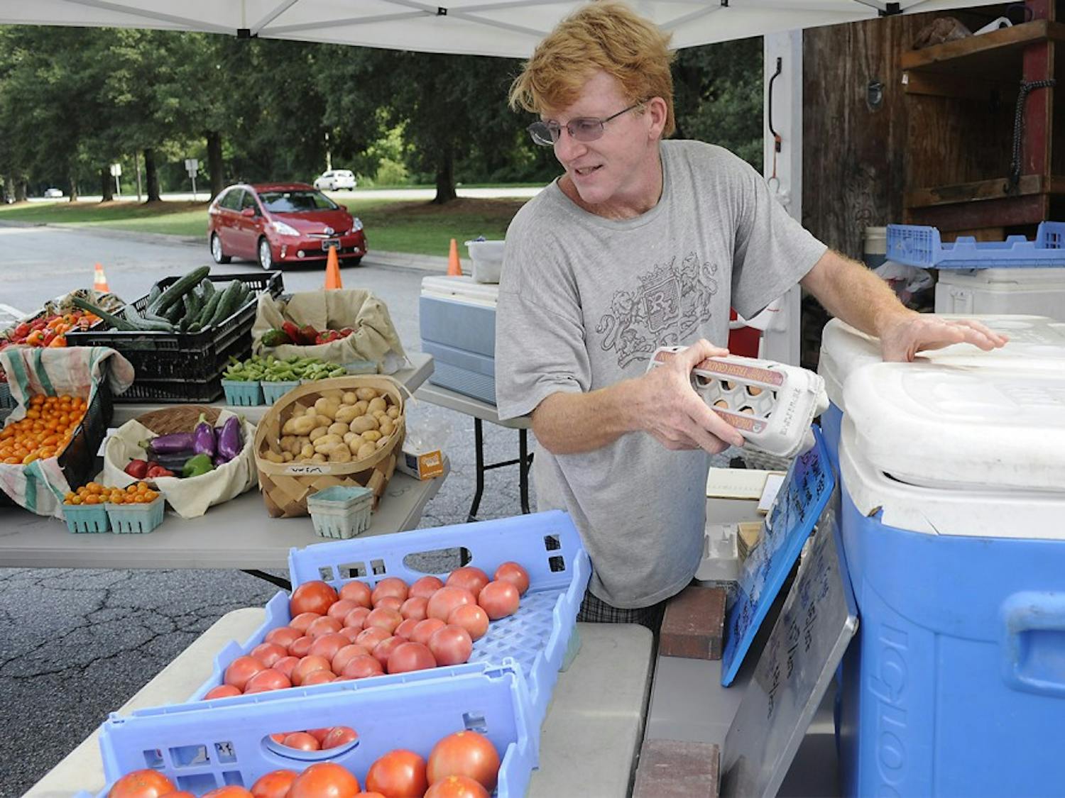 Ben Bergmann, a farmer from Fickle Creek Farm, has been a participant of the Chapel Hill Market for 12 years.   Taking place in the parking lot of University Mall, the market is has moved its location several times.  With the prospect of having a permanent home, Bergman says, "I wish it could be here permanently but it's a little tenuous to be honest.  It would be nice if we had a longer term commitment from the mall."