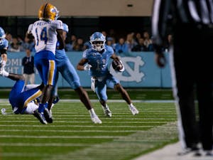 UNC junior wide receiver Josh Downs (11) runs with the ball during the homecoming football game against Pitt at Kenan Stadium on Saturday, Oct. 29, 2022. UNC beat Pitt 42-24.