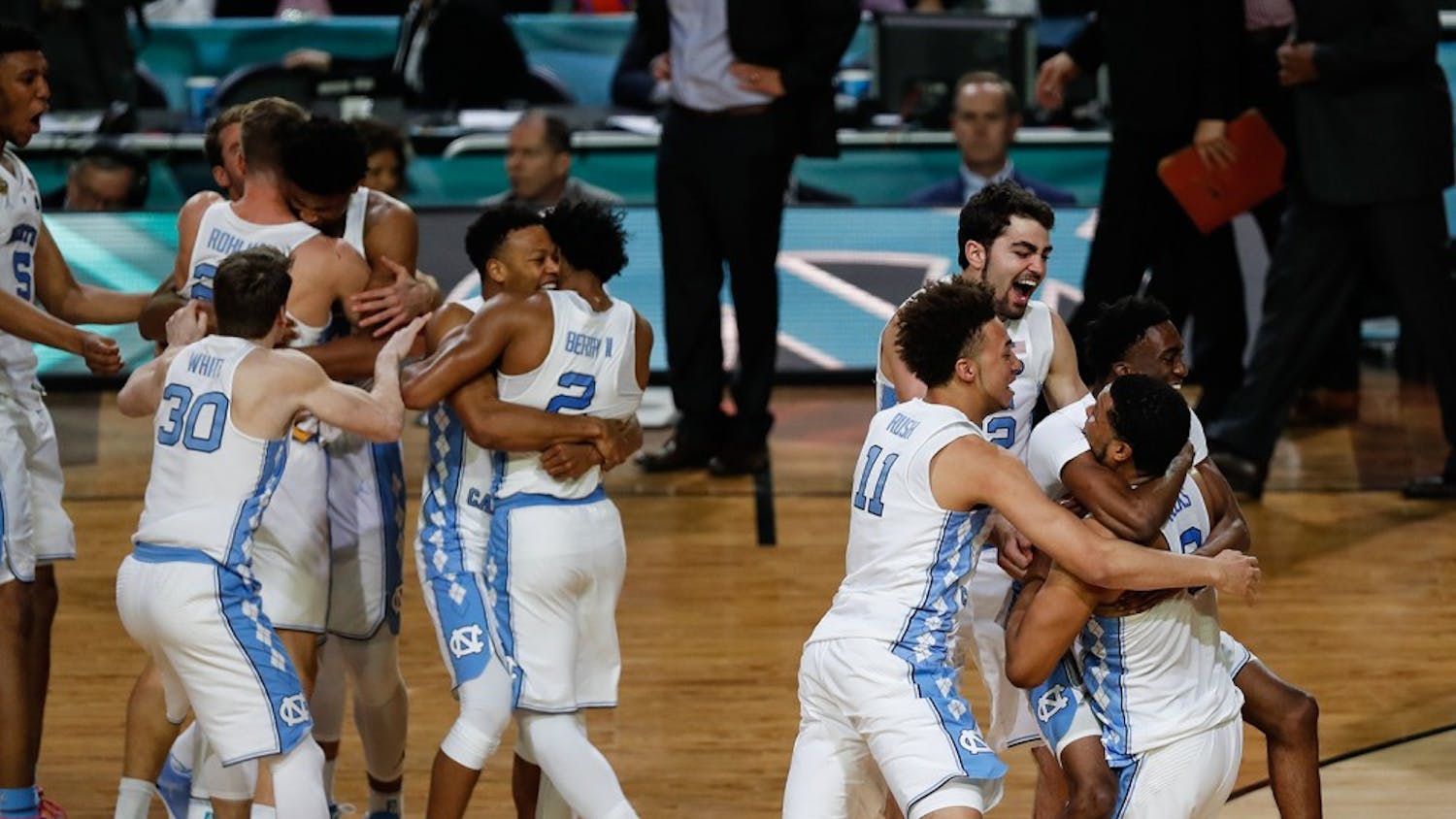 The North Carolina bench erupts into celebration after their win the NCAA Final game against Gonzaga in Phoenix on Monday.