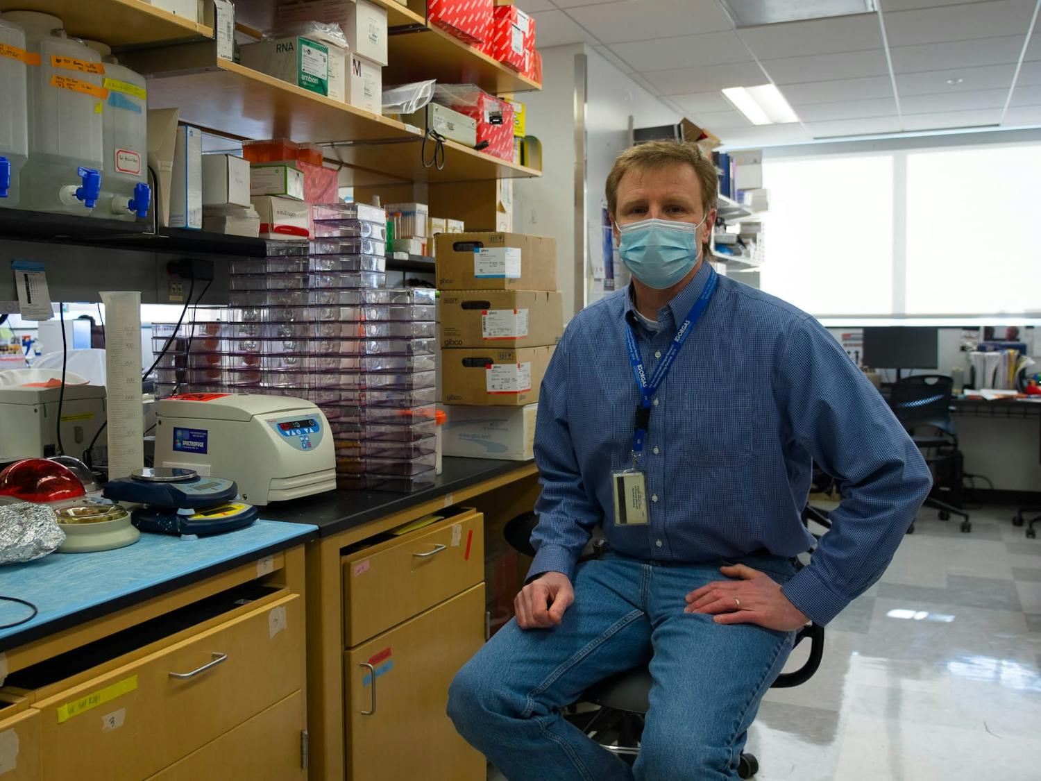 Dr. Mark Heise poses for a portrait in his lab inside the Burnett-Womack building on Monday, Feb. 8, 2021. Heise is a a professor of microbiology, immunology and genetics in the UNC School of Medicine and a collaborator of READDI.