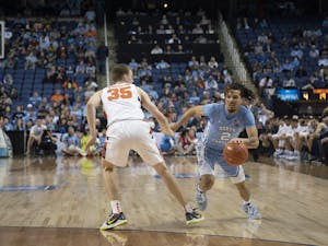 UNC first-year guard Cole Anthony (2) dribbles upcourt against Syracuse in the second round of the 2020 New York Life ACC Tournament at the Greensboro Coliseum, in Greensboro, N.C., on Wednesday, March 11, 2020. UNC lost 81-53.