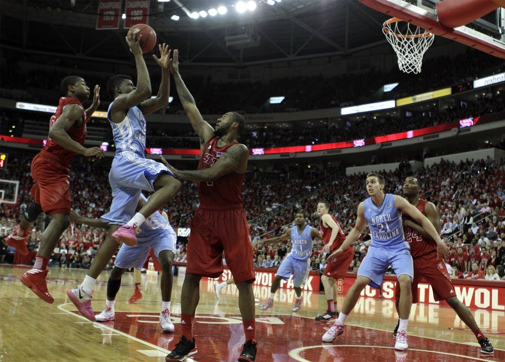 	Reggie Bullock tries to get a shot up against a swarming N.C. State defense.