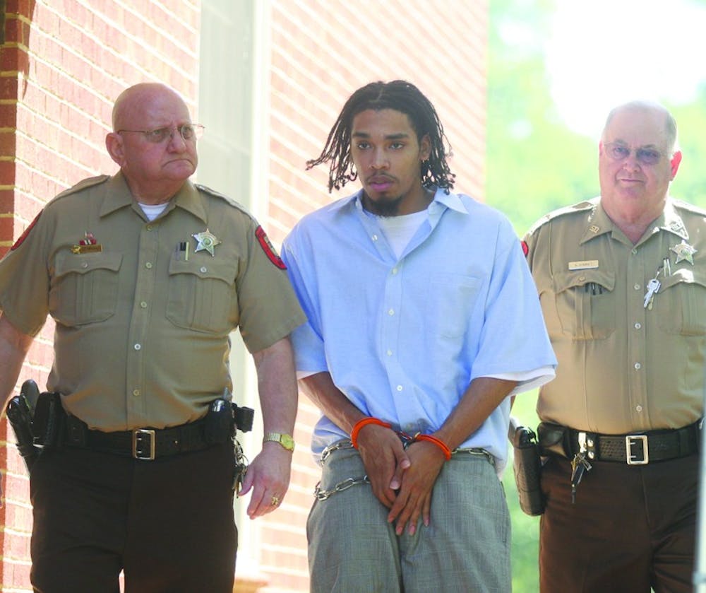 Demario Atwater is escorted to a 2008 Orange County court appearance. DTH File Photo