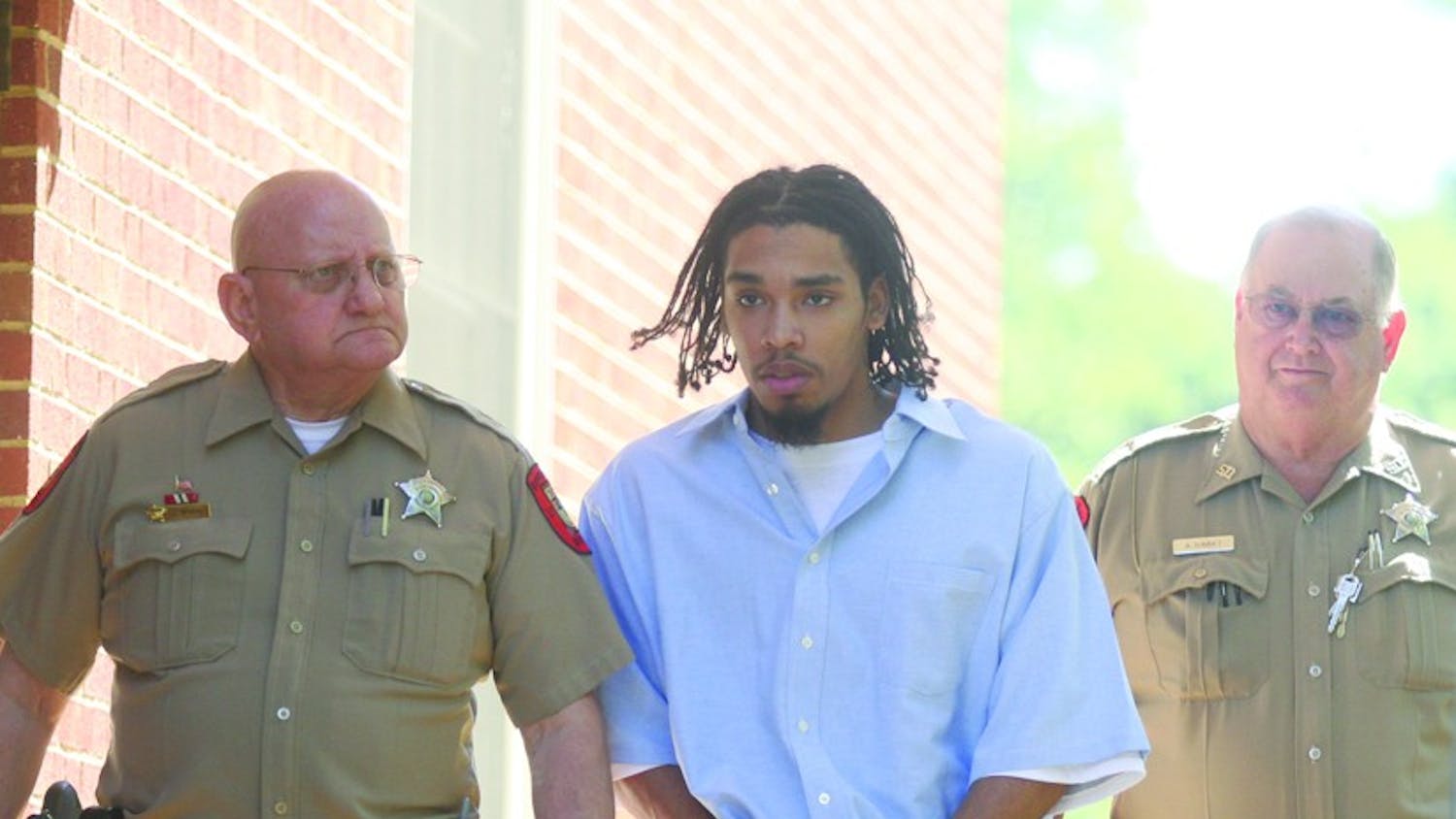 Demario Atwater is escorted to a 2008 Orange County court appearance. DTH File Photo