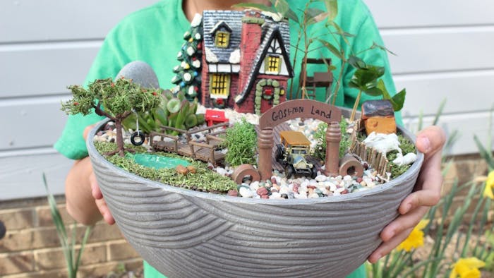 Chapel Hill student Alex Shen holds his miniature garden "GoShen Land" that he created for the Community in Bloom contest. This contest encourages the community to get creative and find "trash and treasures"  around their house to create their own miniature garden. This year's theme is "Planting a Dream" and the deadline to submit your entry is April 25. March 28, 2019. Chapel Hill.