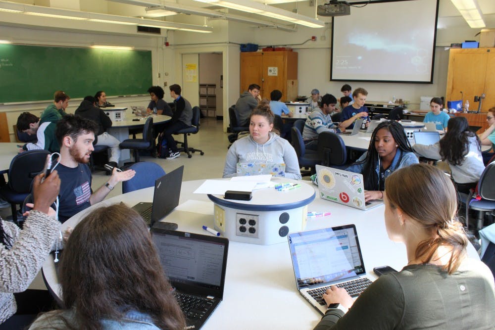 <p>Students prepare for class in Phillips 208 on Monday, March 18, 2019.&nbsp;</p>