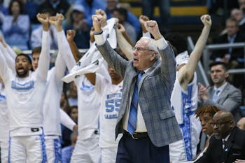 UNC's men's basketball coach Roy Williams cheers from the sidelines during a game against Boston College in the Smith Center on Saturday, Feb. 1, 2020. UNC fell to Boston College by just one point in the last minutes of the game, making the final score 71-70.