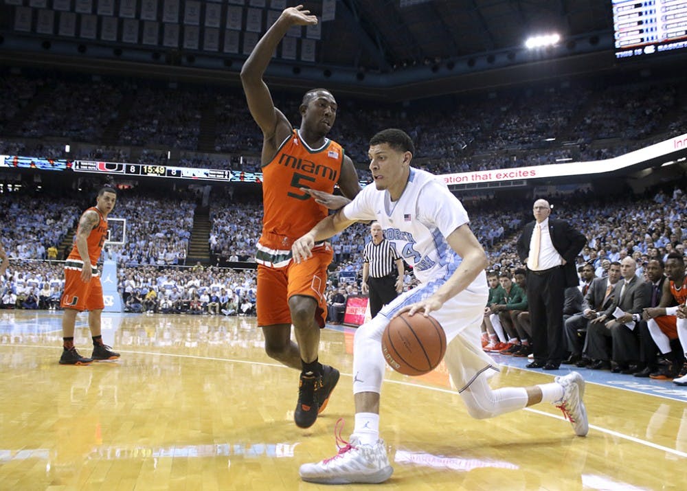 Forward Justin Jackson (44) drives the baseline during UNC Men's Basketball's route of Miami on Saturday.