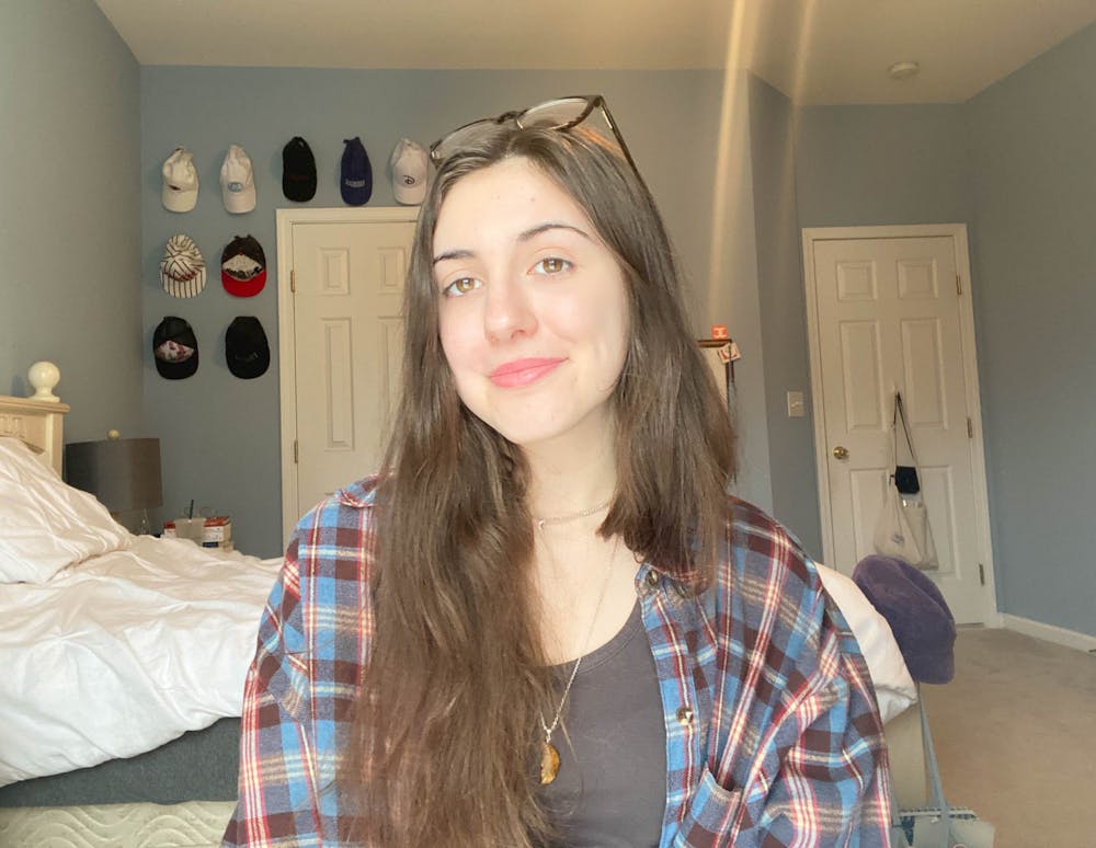 DTH Editorial Board member Caitlyn Yaede poses for a virtual portrait from her home on March 13, 2021. Yaede writes about her struggles as a first-generation college student during the COVID-19 pandemic.