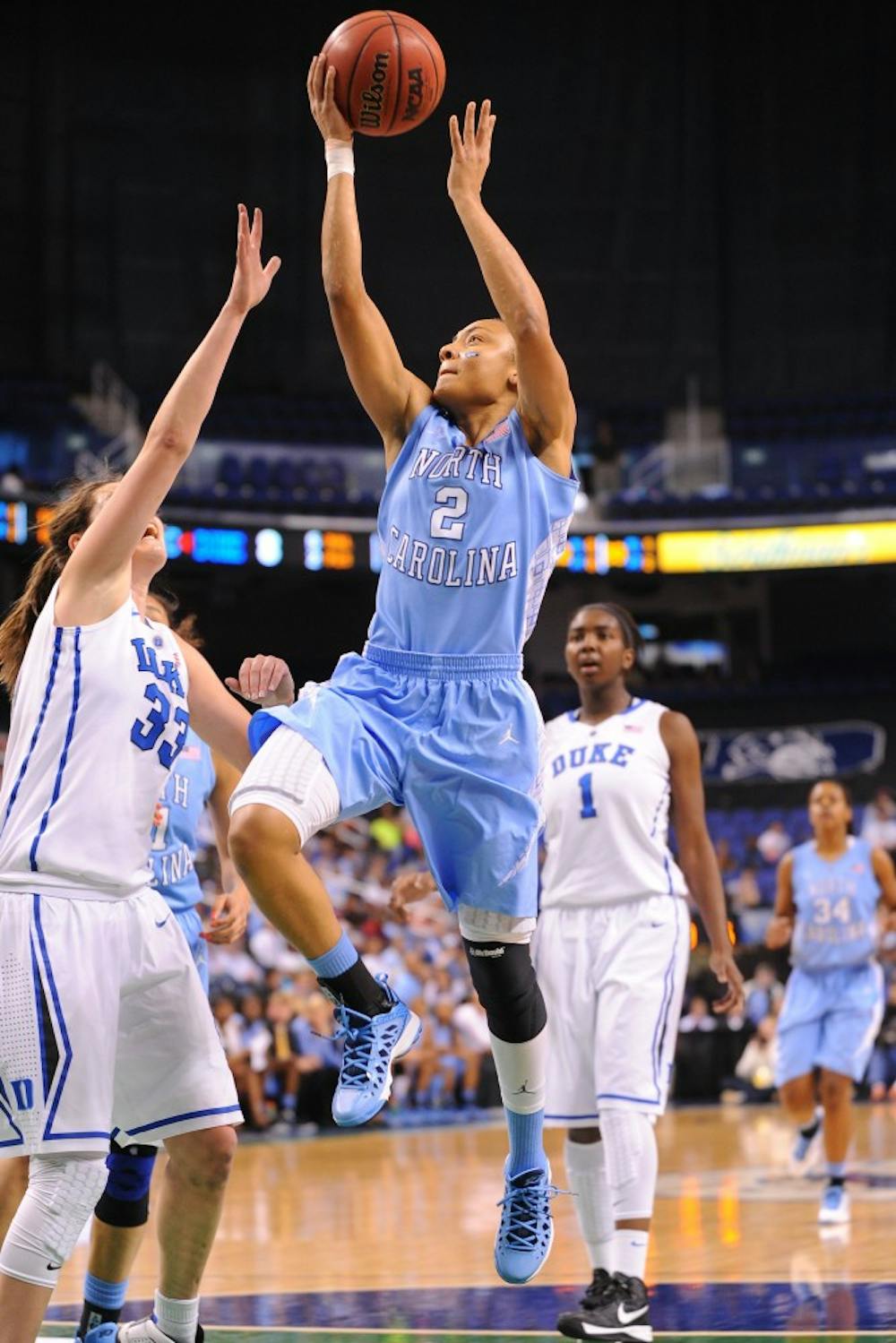 Latifah Coleman (2) of the North Carolina Tar Heels takes a shot over Haley peters (33) of the Duke Blue Devils