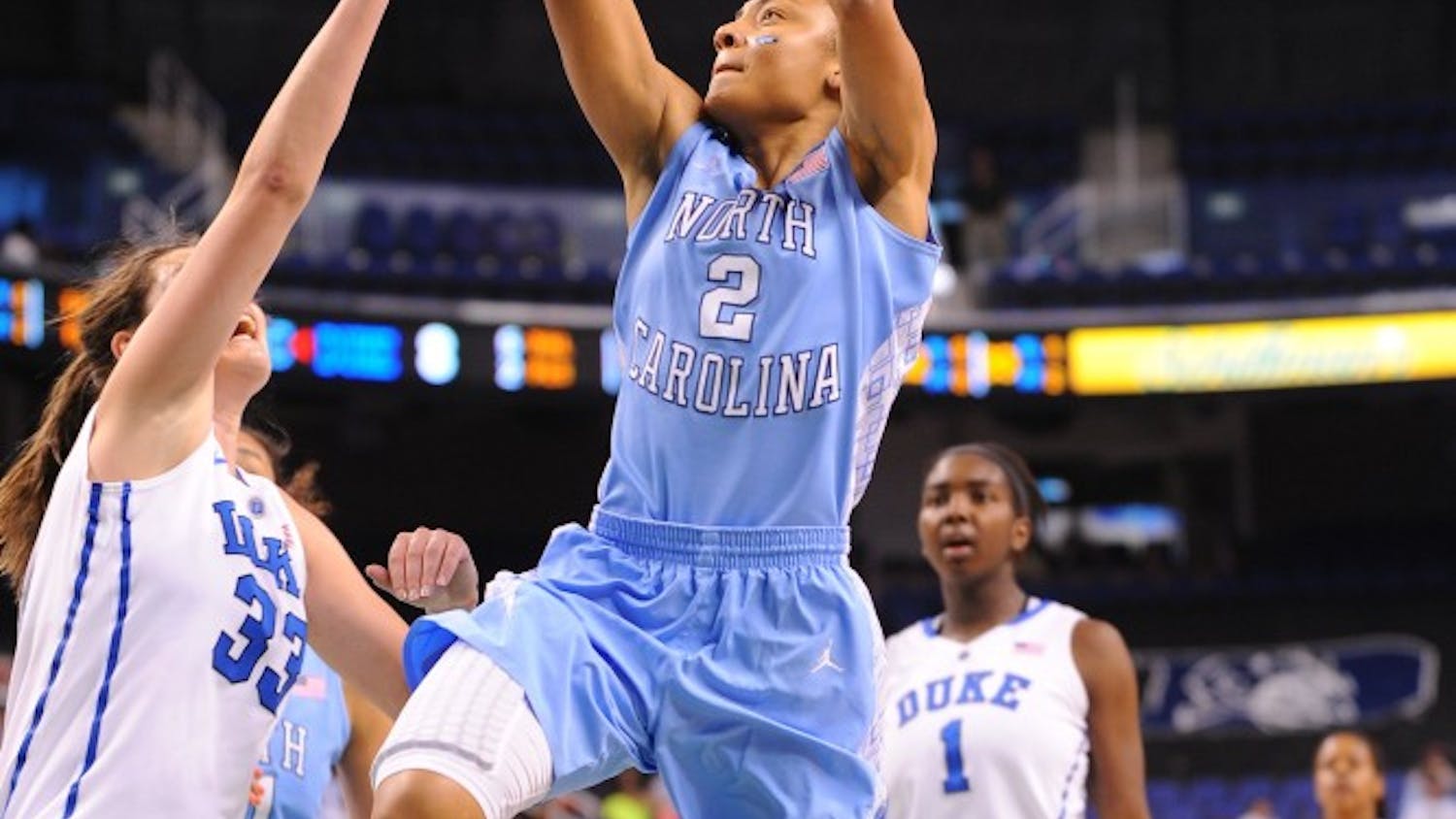 Latifah Coleman (2) of the North Carolina Tar Heels takes a shot over Haley peters (33) of the Duke Blue Devils