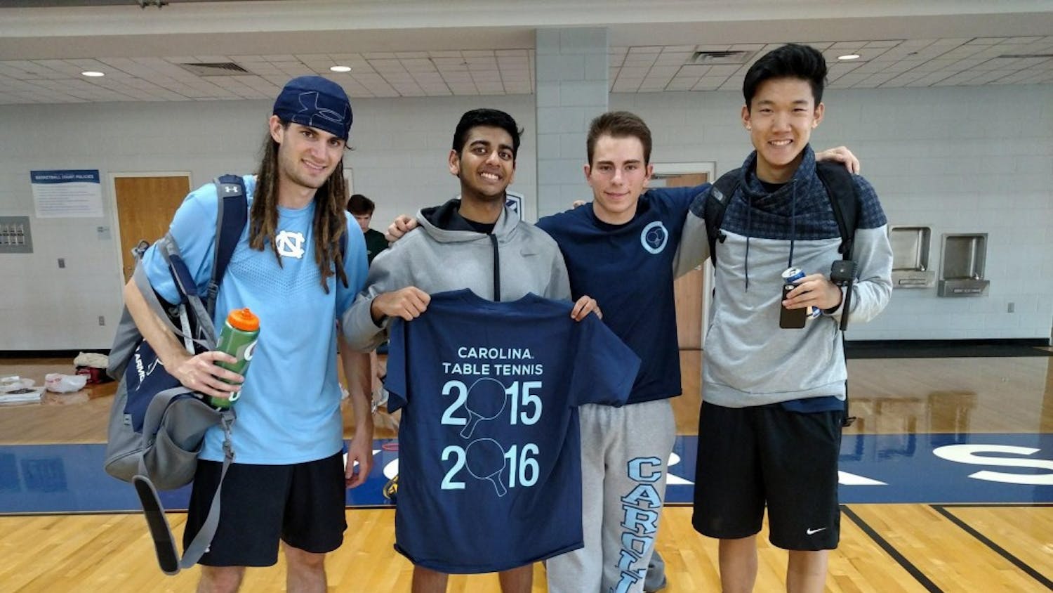 From left,&nbsp;Luke brown,&nbsp;Steven DeePee, Alex Gartland and Andrew Chang pose with a 2015 table tennis t-shirt.&nbsp;Photo courtesy of Alexander Gartland.&nbsp;