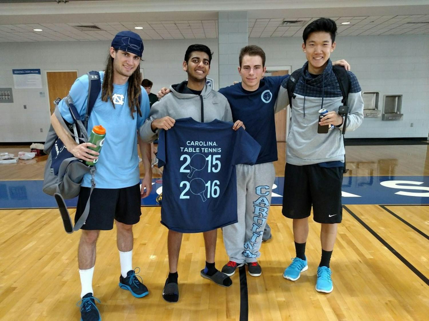 From left,&nbsp;Luke brown,&nbsp;Steven DeePee, Alex Gartland and Andrew Chang pose with a 2015 table tennis t-shirt.&nbsp;Photo courtesy of Alexander Gartland.&nbsp;