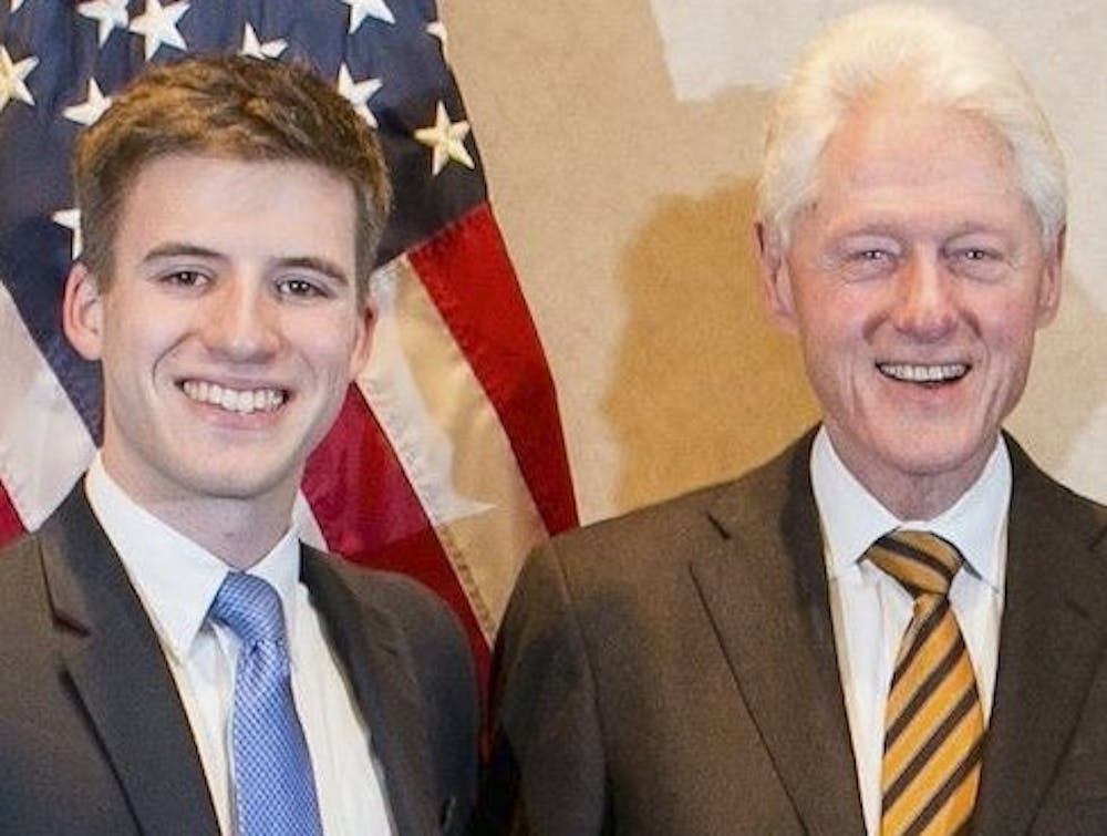 <p>(Courtesy of Tanner Glenn)&nbsp;Tanner Glenn with former President Bill Clinton. Glenn is acting as Rich Nixon’s campaign manager. Nixon is running for the 26th district seat in the N.C. House.</p>