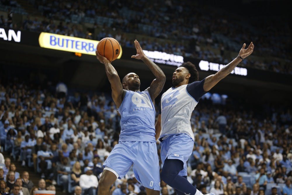 Seventh Woods goes up against Joel Berry during a scrimmage at Late Night With Roy on Friday night.