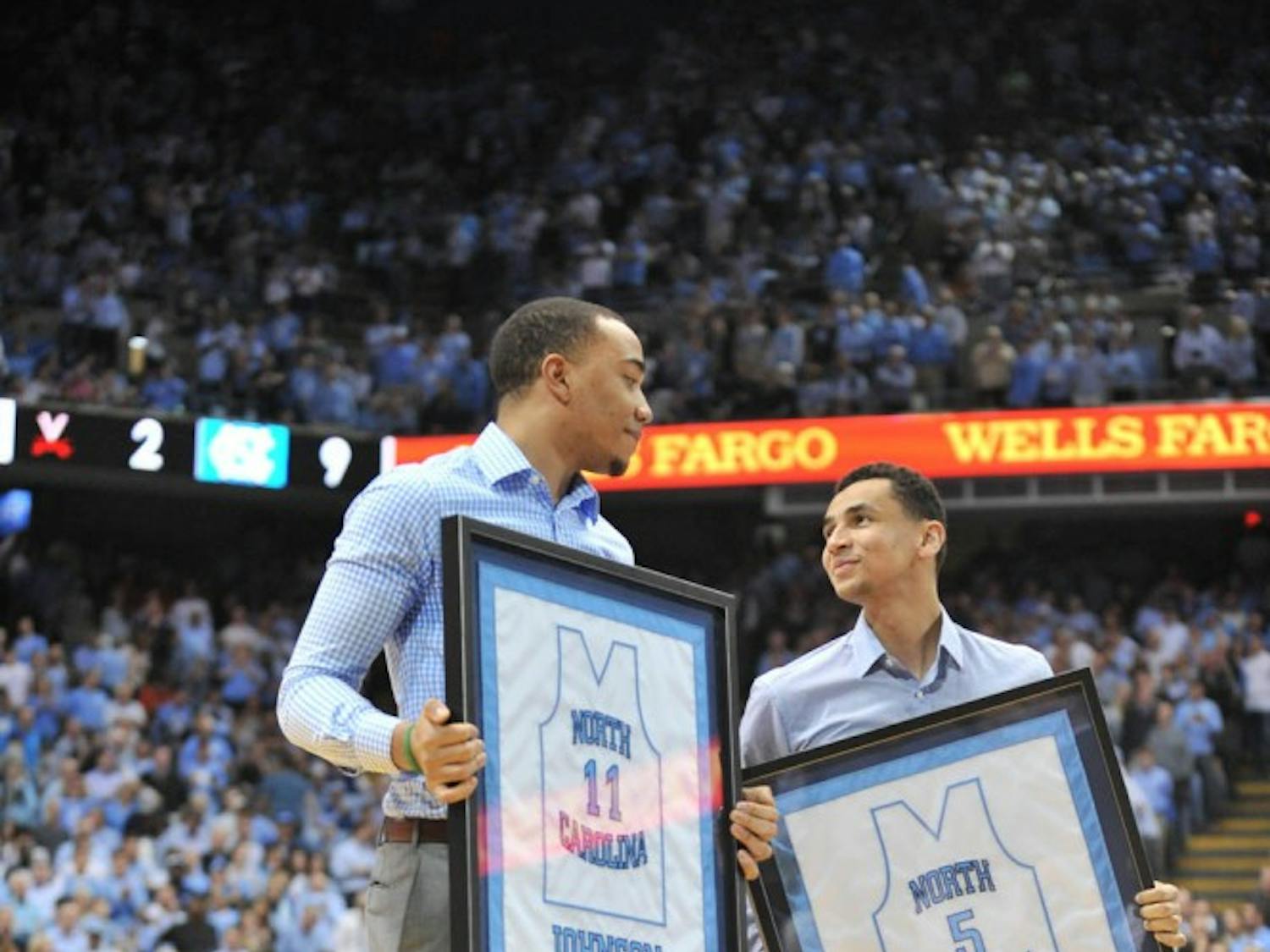 The North Carolina men's basketball team defeated Virginia 65-41 in Chapel Hill Saturday night. Former teammates Brice Johnson and Marcus Paige were honored at halftime.