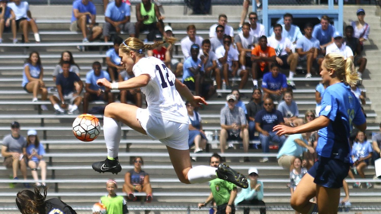 The UNC soccer team defeated UCLA 3-1 on Sunday Sept. 13. Forward Jessie Scarpa (12) finds a way around UCLA keeper Arielle Schechtman (00) to score her second goal of the game and bring the score to 3-1.