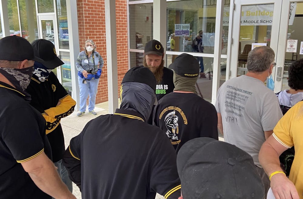 <p>The Proud Boys gather outside of an Orange County Schools Board of Education meeting on Oct. 11, 2021. Photo courtesy of Allison Mahaley.&nbsp;</p>