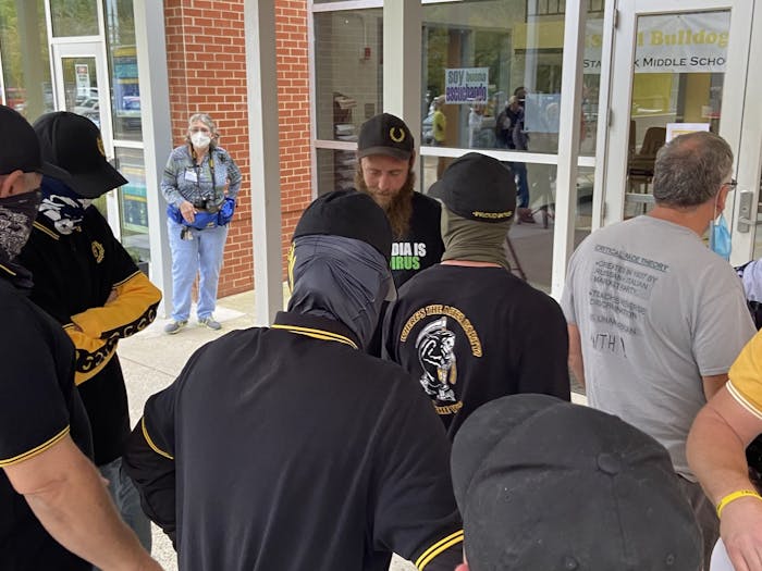 The Proud Boys stand outside of the Orange County Schools Board of Education meeting on Oct. 11. Photo courtesy of Allison Mahaley.&nbsp;