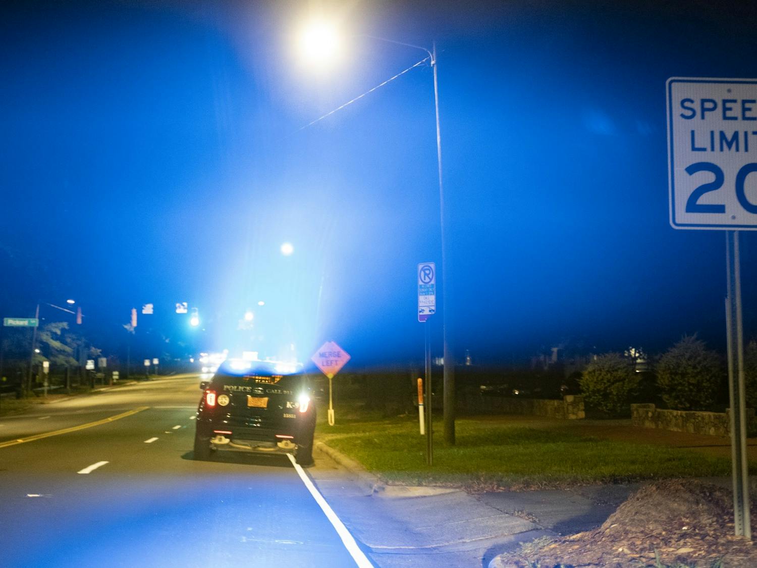 A police car parked on Franklin Street flashes its lights on Saturday, Aug. 29, 2020.